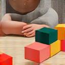 Child playing with colorful wooden Montessori-style blocks, hands-on learning.